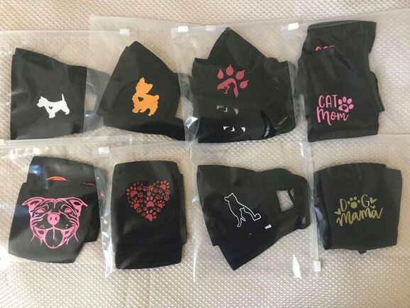 Picture of face masks with dog and cat designs